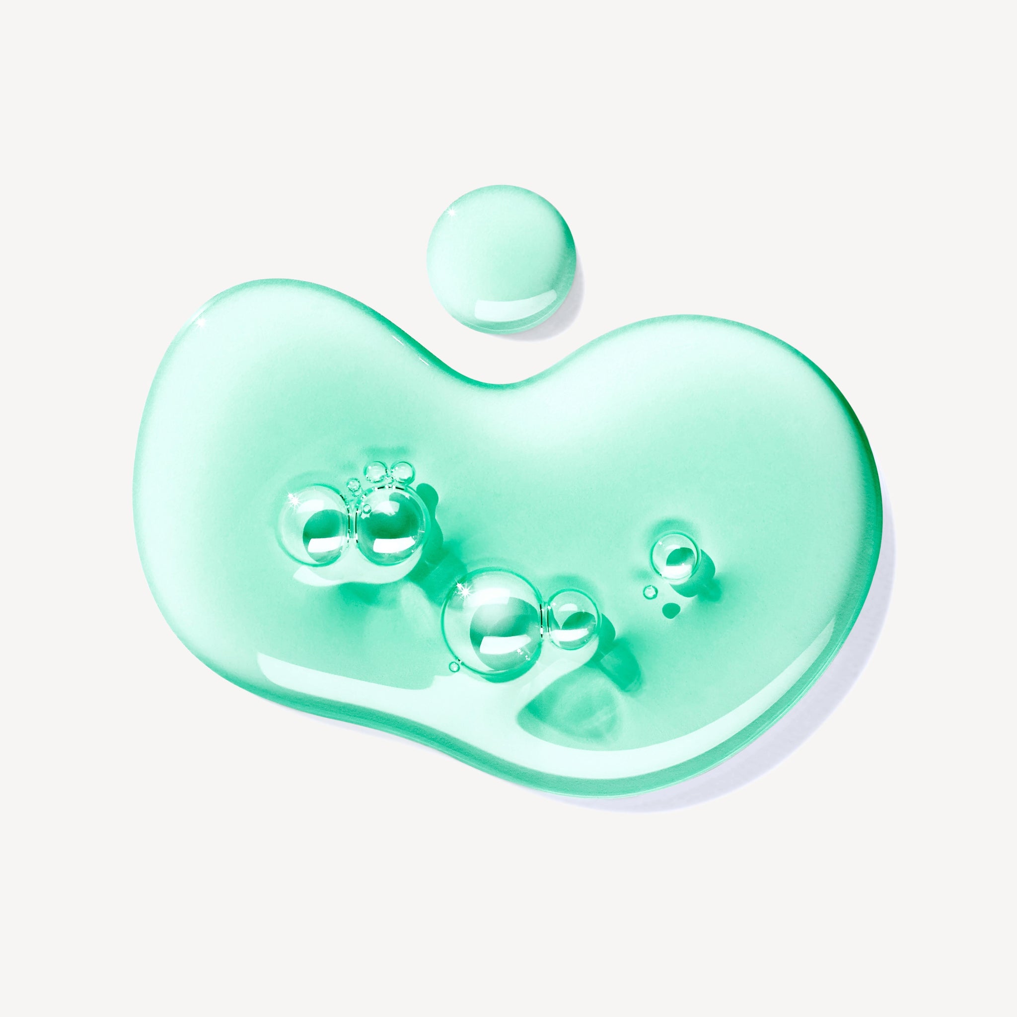 A translucent, light teal gel with bubbles—Wild Mint & Lavandin Bath & Shower Gel 300ml—spread organically on a white background.