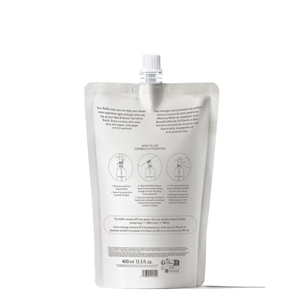 A white refill pouch with a spout cap, shown from the back, displays minimal black prints and icons. Instructions for conscious cleansing and refilling appear above the volume label: Fiery Pink Pepper Bath & Shower Gel Refill 400ml (13.5 fl. oz.).