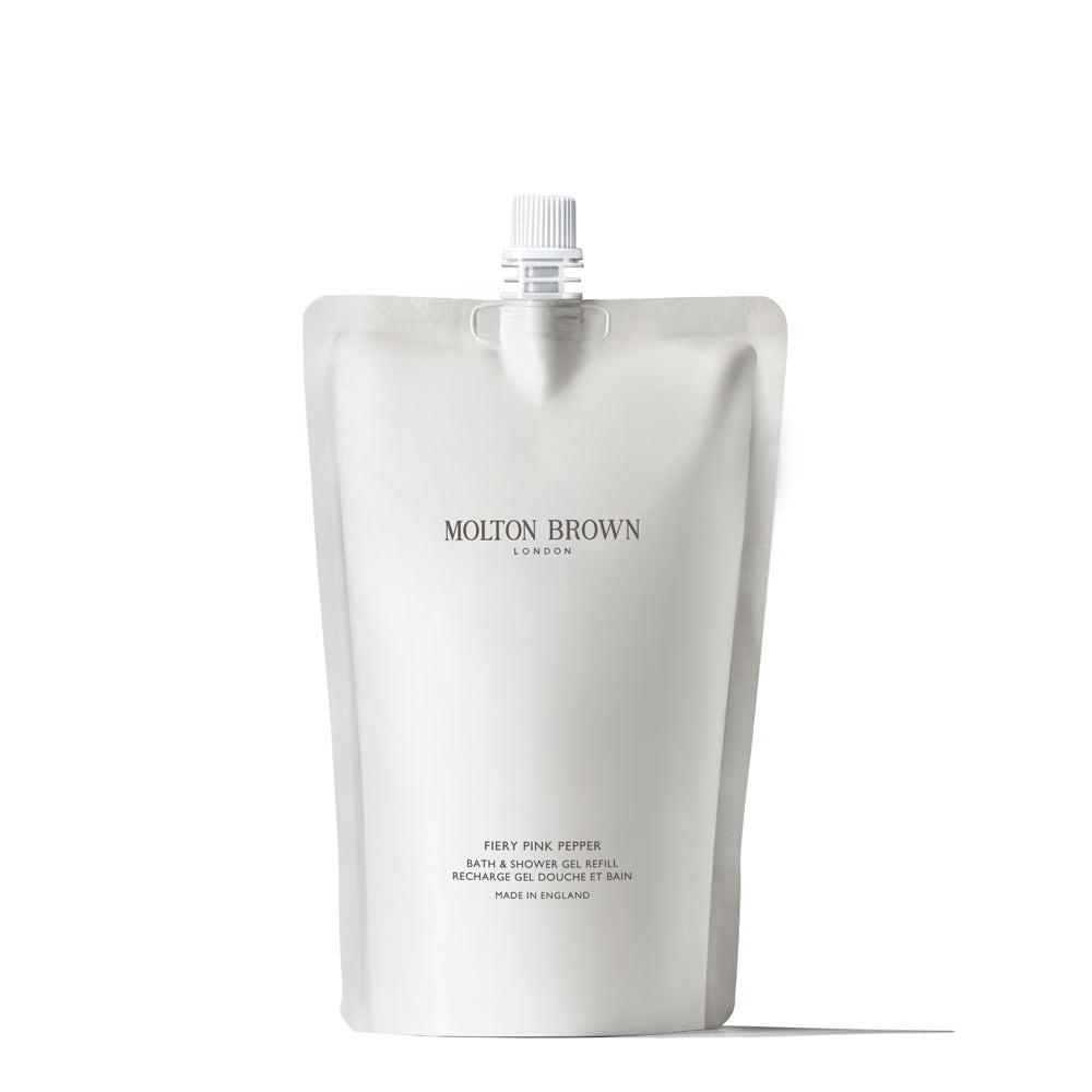 A white, minimalist Molton Brown refill pouch with a top spout and label reading “Fiery Pink Pepper Bath & Shower Gel Refill 400ml”—a conscious cleansing solution—stands upright against a white background.
