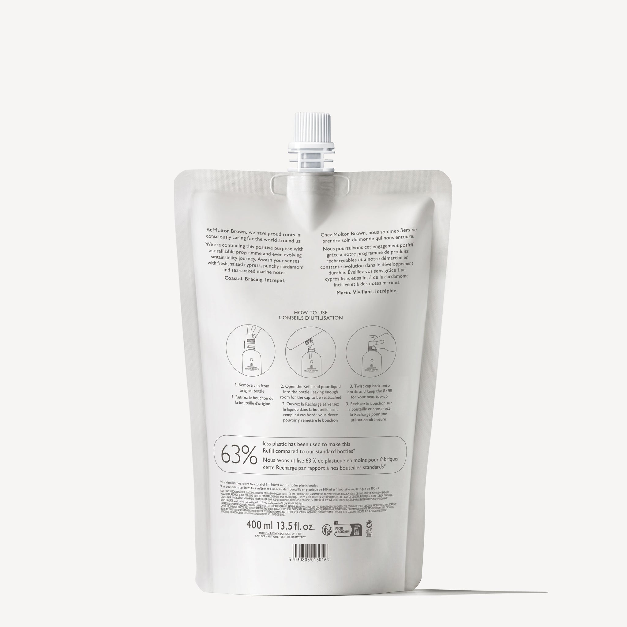 A silver refill pouch with a screw cap stands upright. The back label displays text, icons, and instructions in English and French. Inside is 400ml of Coastal Cypress & Sea Fennel Bath & Shower Gel.