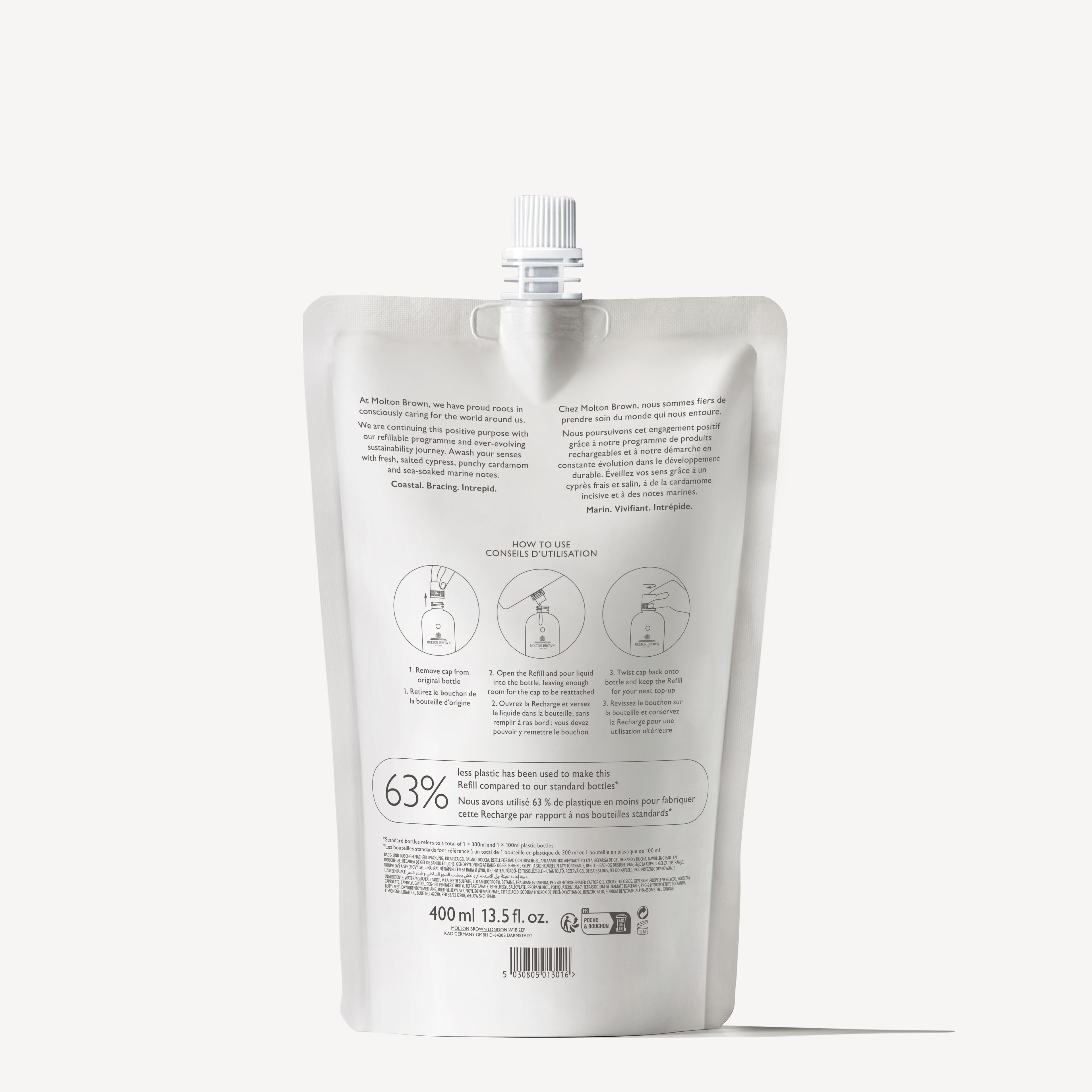A silver refill pouch with a screw cap stands upright. The back label displays text, icons, and instructions in English and French. Inside is 400ml of Coastal Cypress & Sea Fennel Bath & Shower Gel.